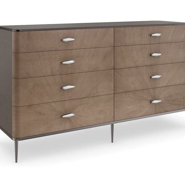 Prism Dresser by Caracole — a 66″‑wide eight‑drawer dresser in Chocolate Tiger Maple with double starburst veneer pattern radiating from the bottom drawers, rounded edges, Galaxy Bronze top and side panels framed in Deep Bronze metal, featuring soft‑close guides, painted drawer interiors, and faceted ivory‑resin handles encased in Deep Bronze.