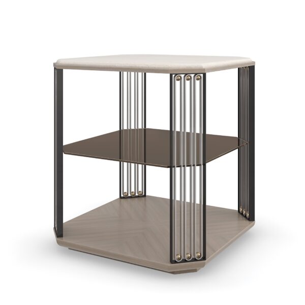 Alloy End Table by Caracole – Crème Travertine stone top with ornamental metal legs in Brushed Gold, Brushed Stainless, and Deep Bronze, featuring a smoked bronze glass shelf.