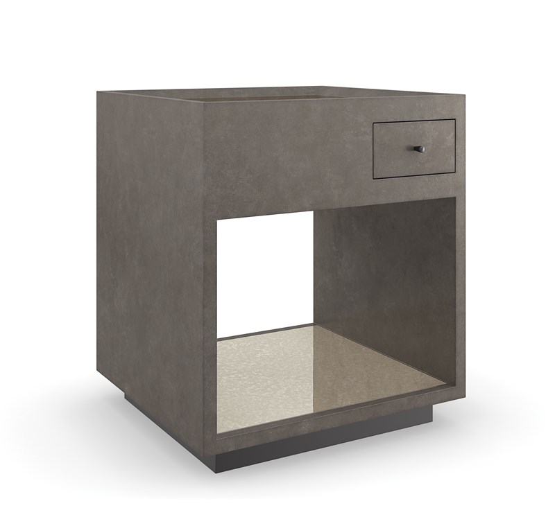 Dark Matter End Table by Caracole — a sleek modern end table with a dark textured top and metal base.