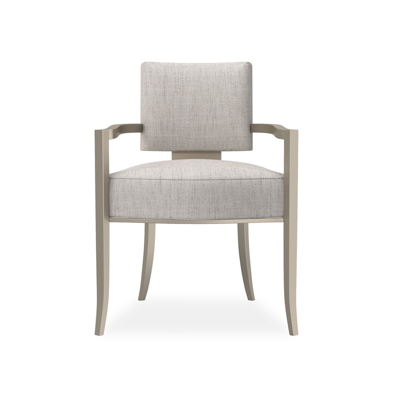 Reserved by Caracole — a sophisticated armchair with plush upholstery and smooth, curved lines.