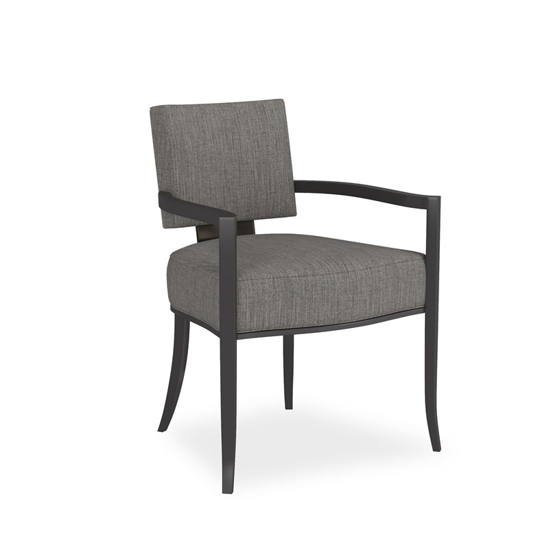 Reserved Seating Arm by Caracole — an elegant dining armchair with plush upholstery and a curved backrest.