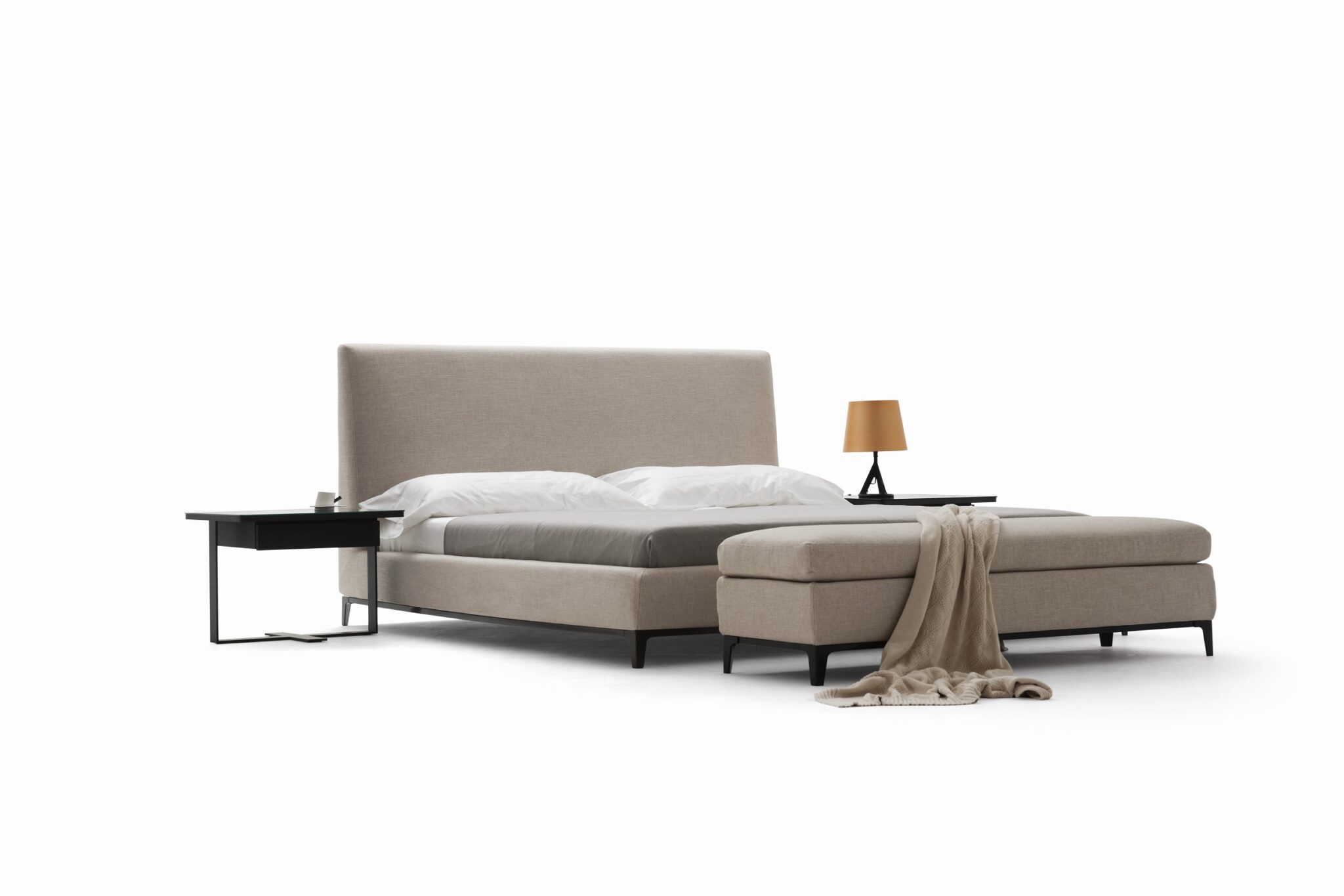 Elegant upholstered bed with curved headboard and modern design by Camerichusa.