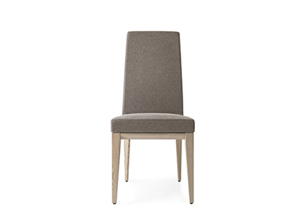 "BESS dining chair by Calligaris with upholstered seat and tapered wooden legs in walnut finish."