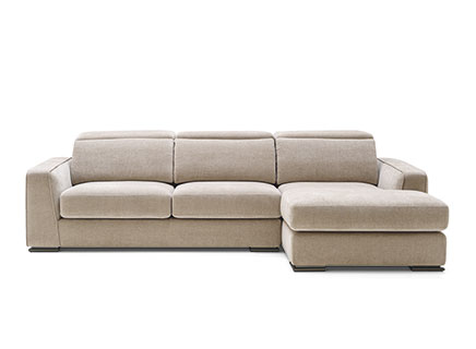 A contemporary Calligaris Cast sectional sofa with a chaise lounge on the right, upholstered in a light beige or taupe fabric, featuring adjustable headrests and slender dark metal feet.