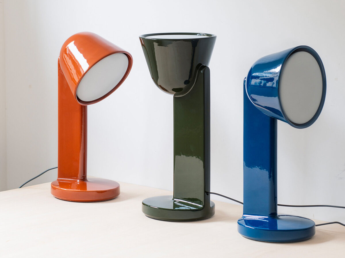Modern ceramic table lamp with a curved silhouette and downward light projection, Céramique Down by Flos.
