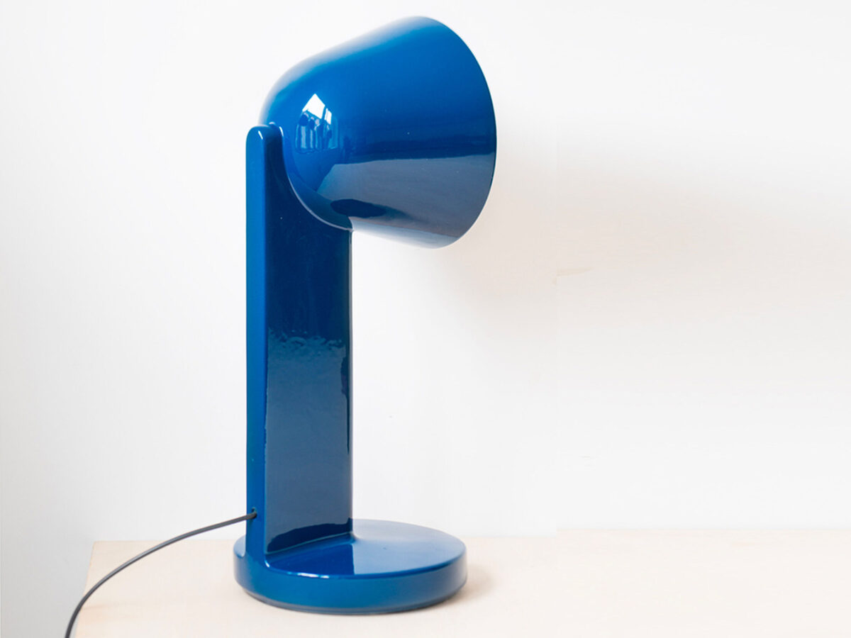 Close-up of the Céramique Down lamp by Flos, highlighting its seamless glazed surface and soft downward glow.