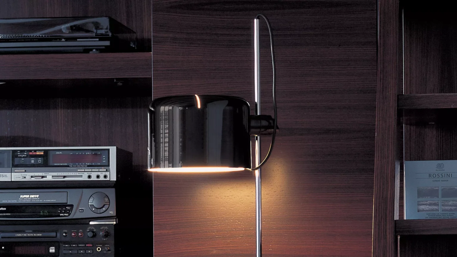 “Coupé by Oluce contemporary lamp – elegant Italian design with tilting head and polished chrome stem”