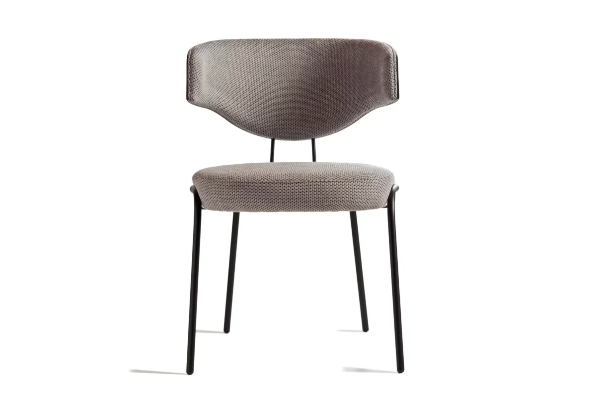 CURVE W chair by Peressini with continuous curved backrest that elegantly wraps around the seat, supported by slender metal legs.