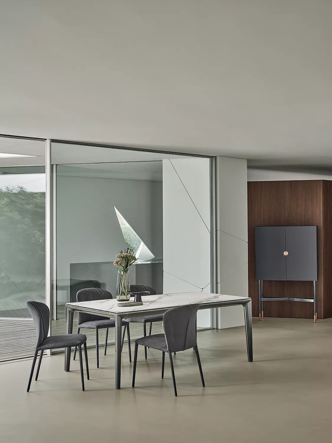 Duke chair by Bontempi in matte blue leather with contrast stitching and gold-tone legs.