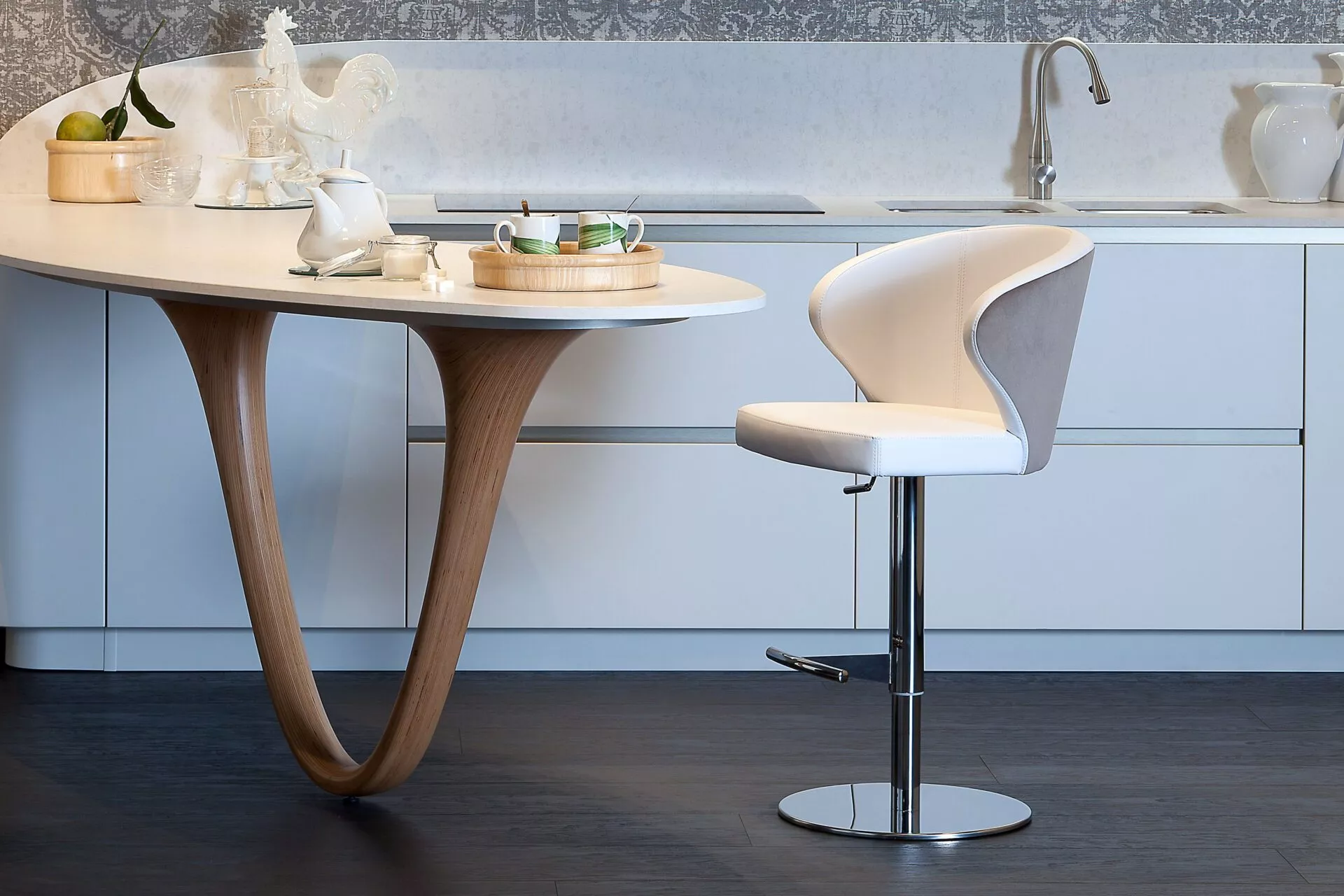 Doris P dining chair by Peressini featuring a sculpted plywood shell, high-density foam cushioning, and tapered metal legs in matte black.