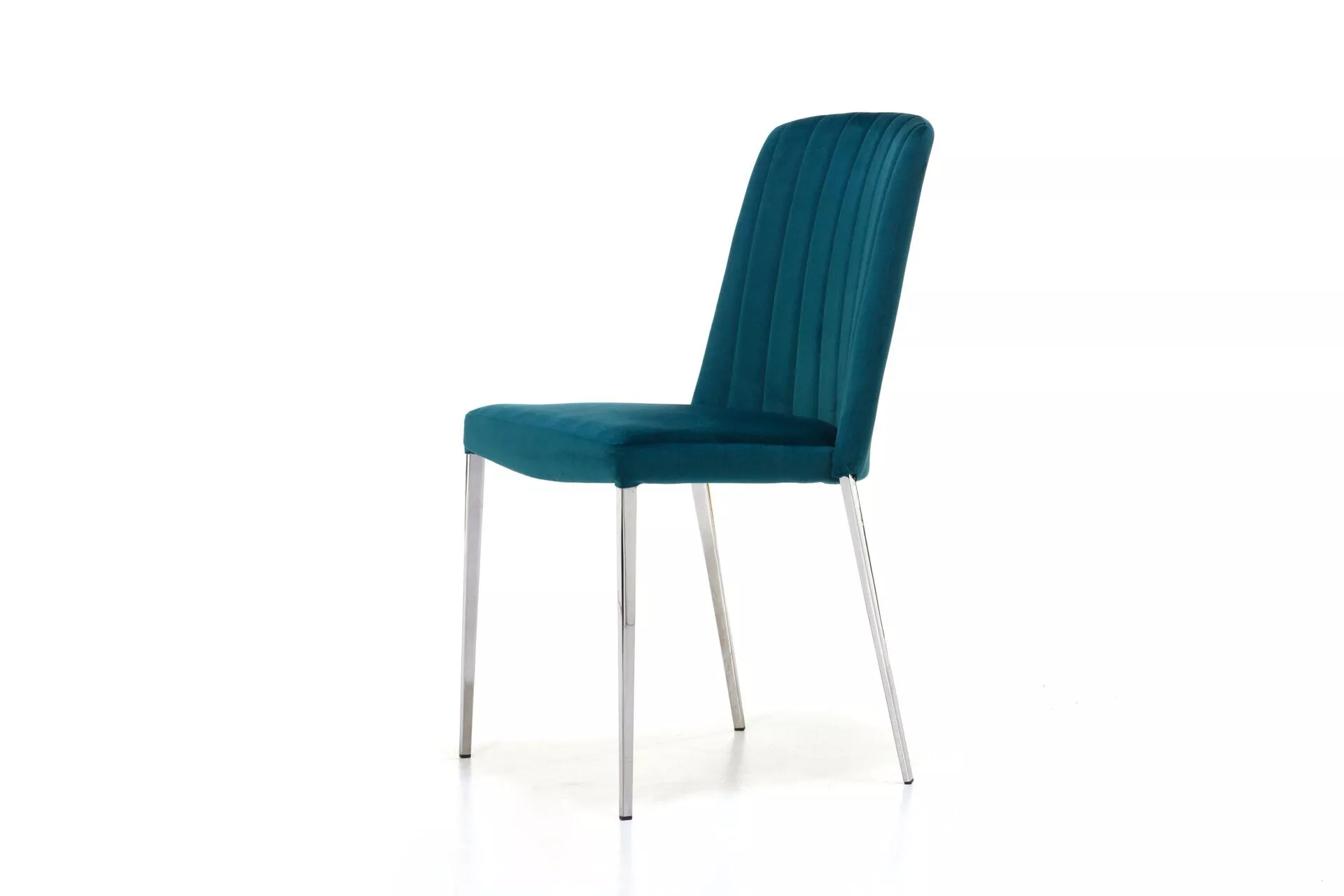 Dream 3 chair in teal velvet with tall, vertically quilted backrest and slim tapered metal legs, set against a white studio background.