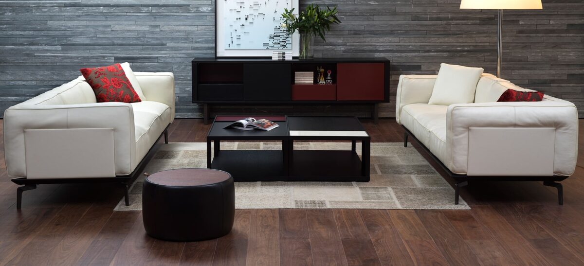 Round upholstered ottoman with soft fabric and minimalist design by Camerich.