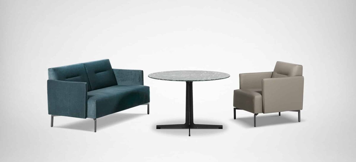 Stylish lounge seat with box-shaped profile, cushioned seat, and low steel feet
