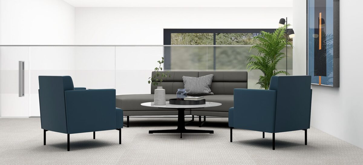 Upholstered Ease chair showing stitched back detail and minimal tubular steel structure