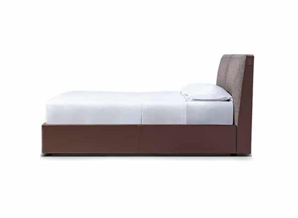 Minimalist upholstered bed with clean lines and low profile by Camerichusa.