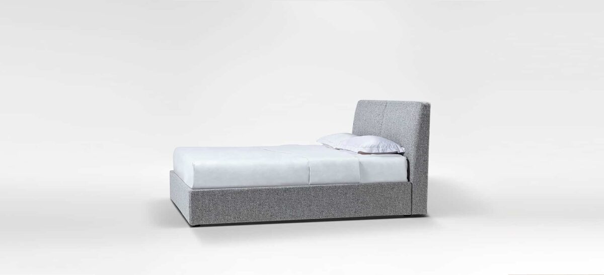 Minimalist upholstered bed with clean lines and low profile by Camerichusa.