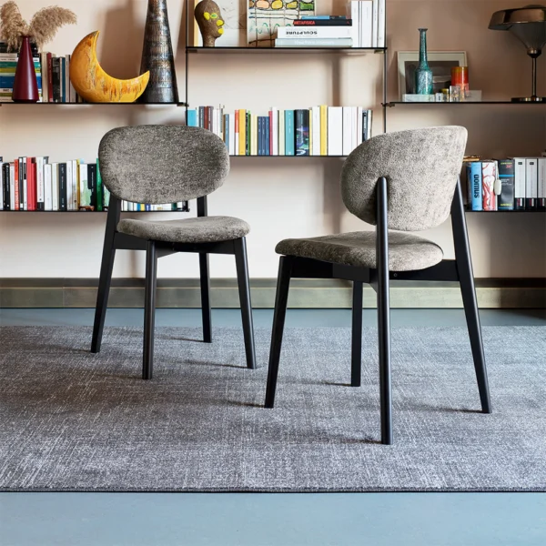 “Eide Soft chair by Connubia – modern upholstered dining chair with curved backrest and slim legs”