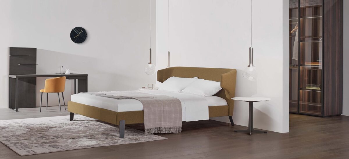 Contemporary upholstered bed with rounded headboard and sleek frame by Camerich.