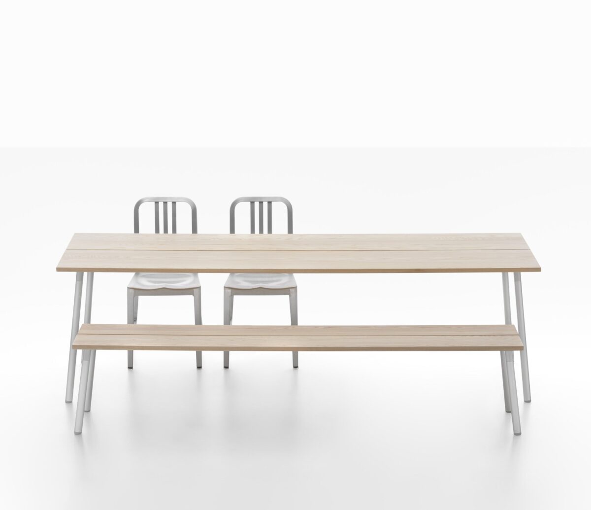 “Emeco Run Bench in wood with minimalist aluminum frame, designed by Sam Hecht and Kim Colin.”