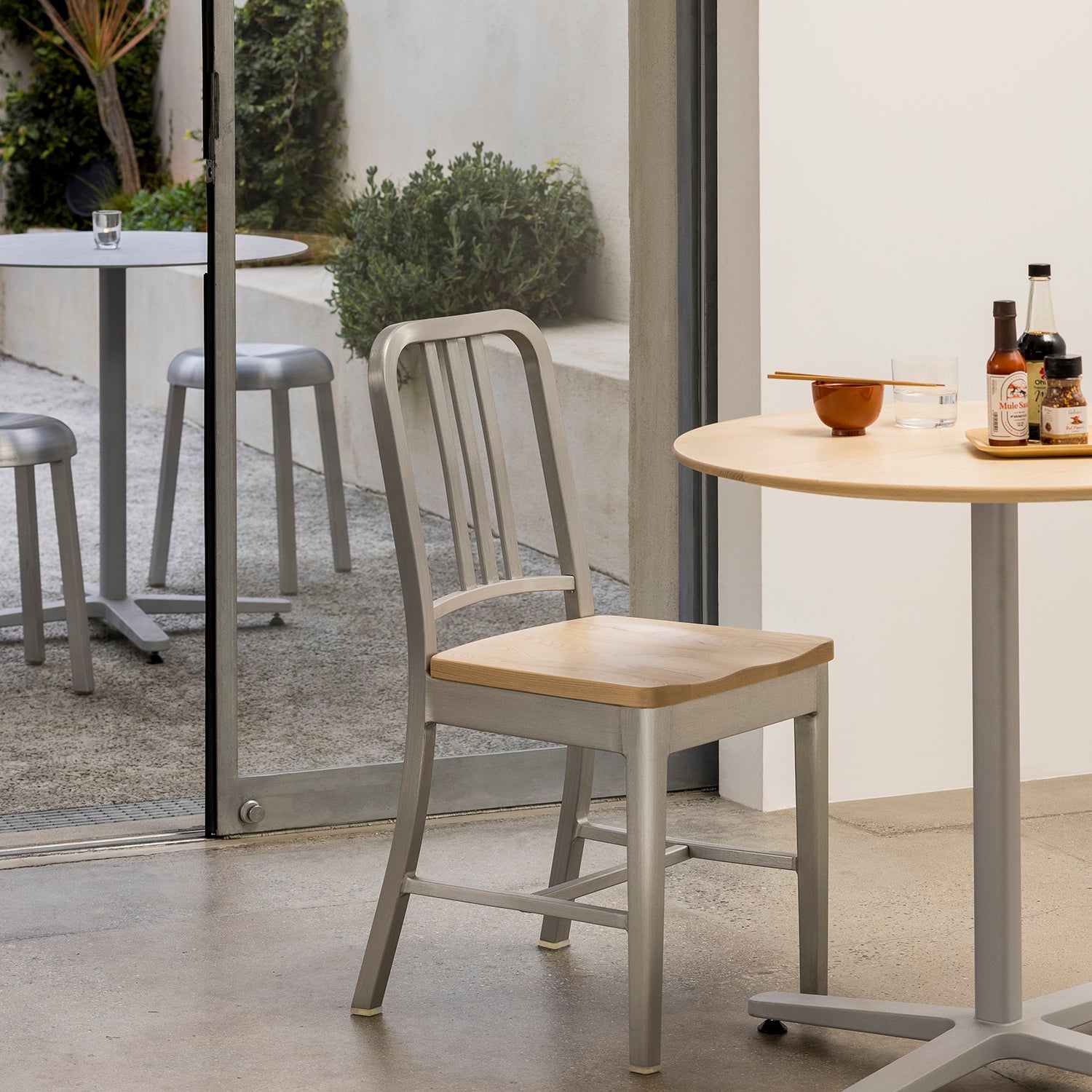 1104 Navy Armchair by Emeco in brushed aluminum finish