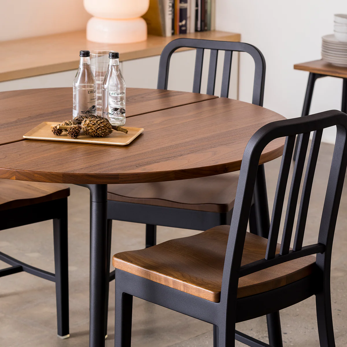 1104 Navy Armchair by Emeco, a timeless and durable design inspired by naval architecture, offering comfort and style for contemporary living rooms and commercial spaces.