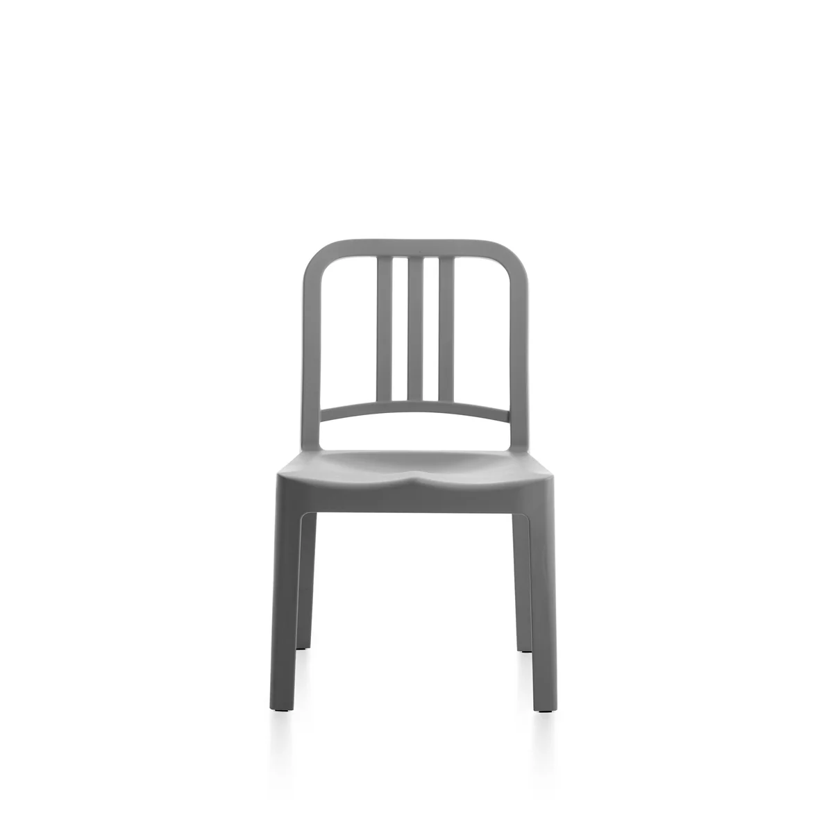 111 Navy Mini Chair in Flint (gray) by Emeco, designed by Coca-Cola and Emeco, features a compact design made from 65% recycled PET plastic and 35% glass fiber, suitable for both indoor and outdoor use.