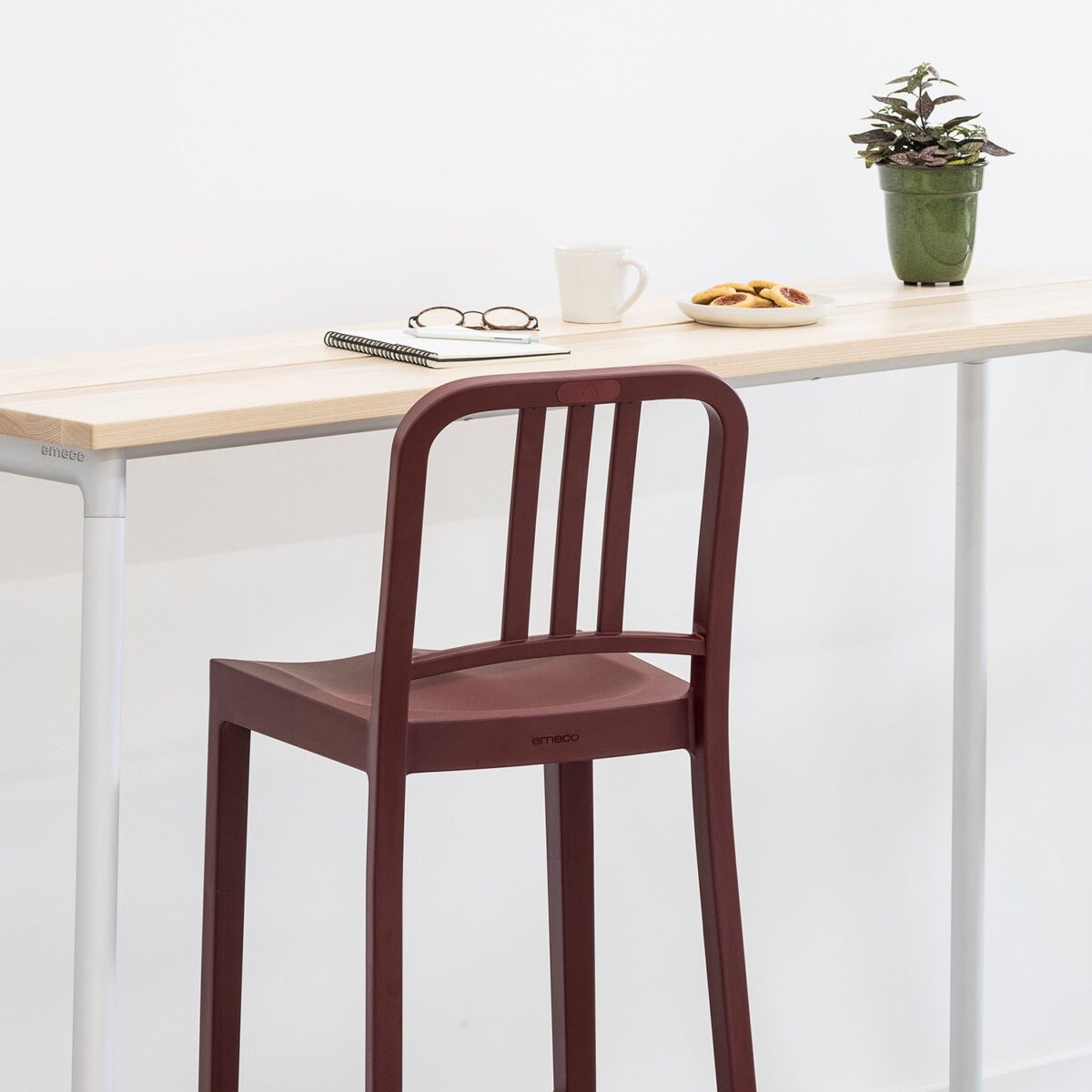 “Eco-conscious Emeco 111 Navy Stool offering long-lasting style for kitchen or bar.”
