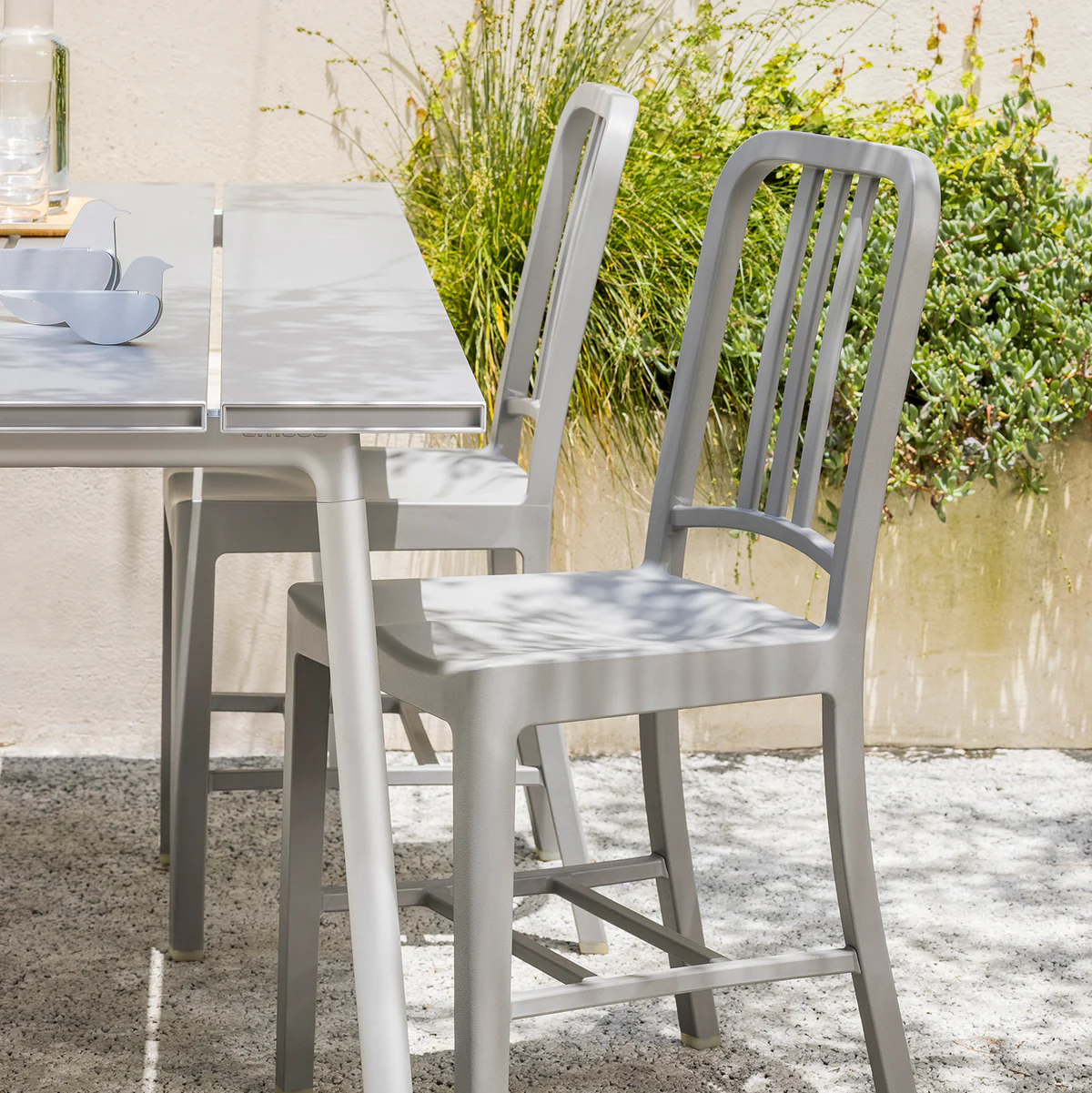 111 Navy Chair® by Emeco, an eco-friendly design made from 111 recycled plastic bottles, combining modern style with sustainable materials for contemporary spaces.