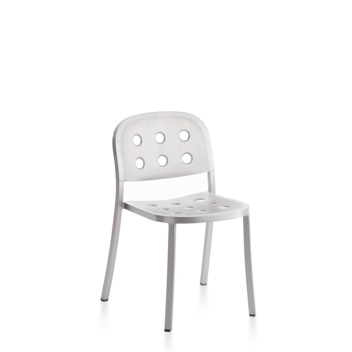 Sleek aluminum chair with perforated seat and backrest, designed by Jasper Morrison, offering a modern industrial aesthetic for both indoor and outdoor use.
