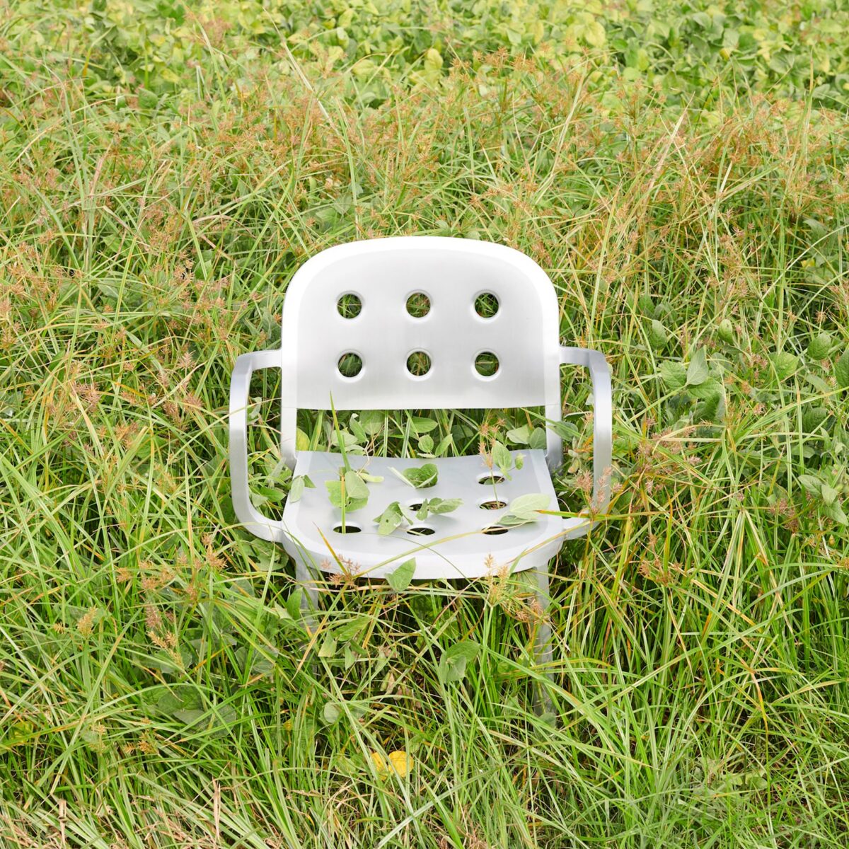 Stylish, all-aluminum 1 Inch Armchair by Jasper Morrison with a clean, industrial look for contemporary spaces.