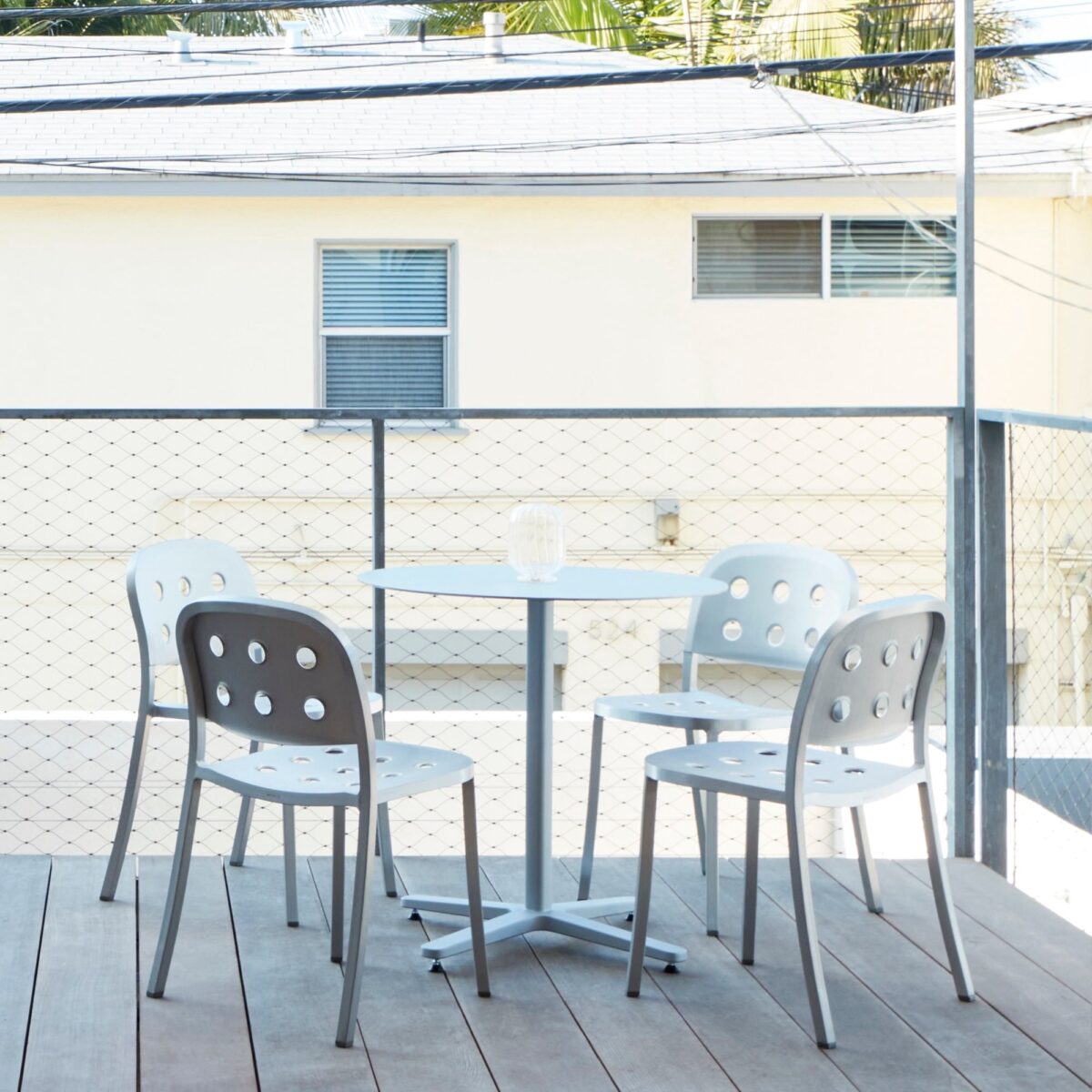 Modern armchair by Jasper Morrison, crafted from all-aluminum with a minimalist, industrial design.