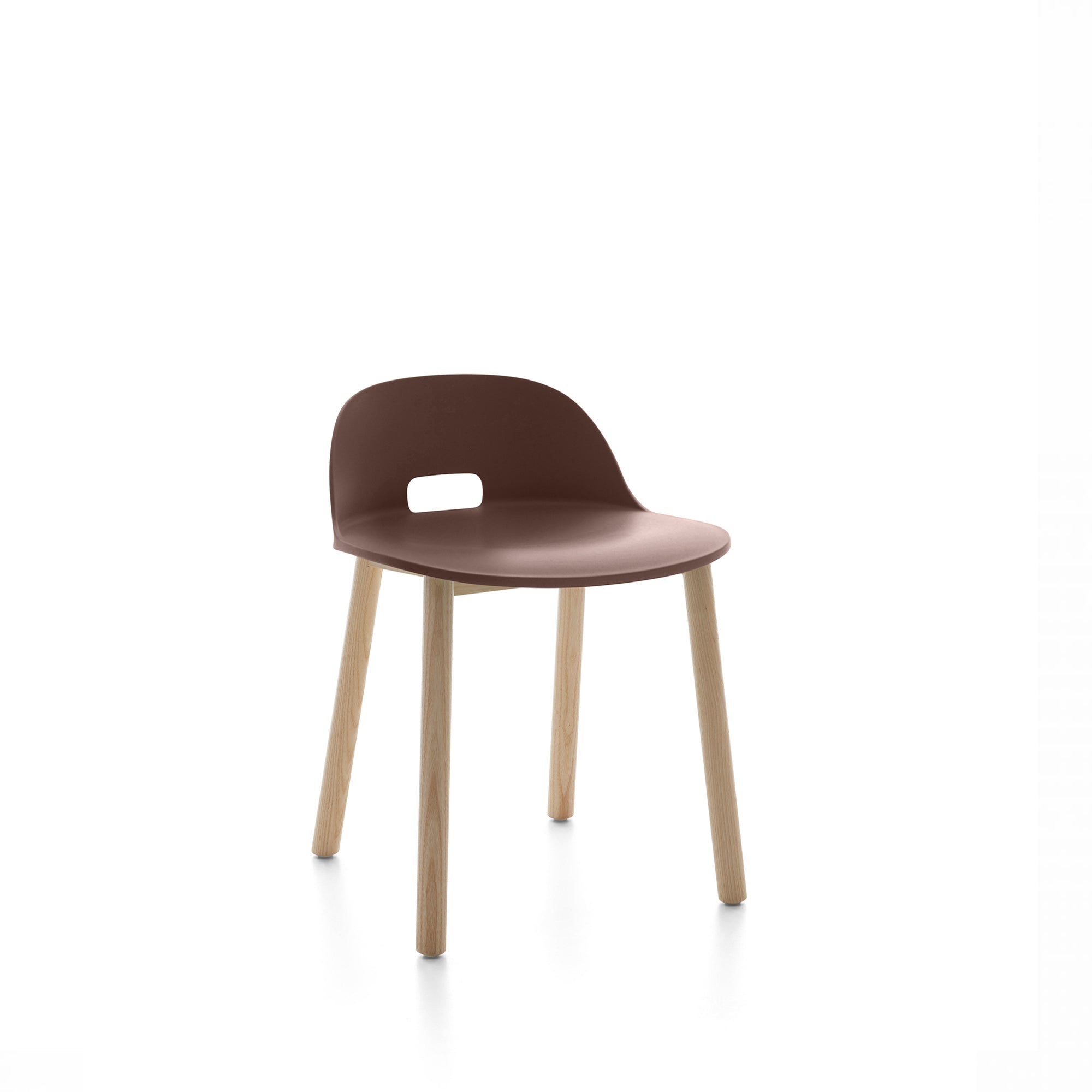 “Minimalist Alfi Chair low back by Emeco, designed by Jasper Morrison with a molded recycled seat and wood base.”