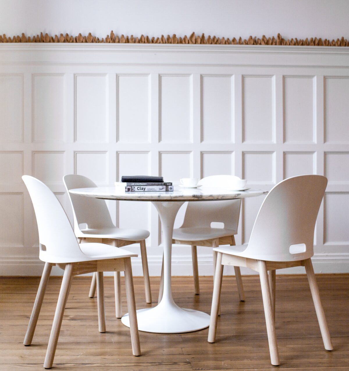 Emeco's Alfi Chair, offering a sleek, minimalist look for contemporary spaces.