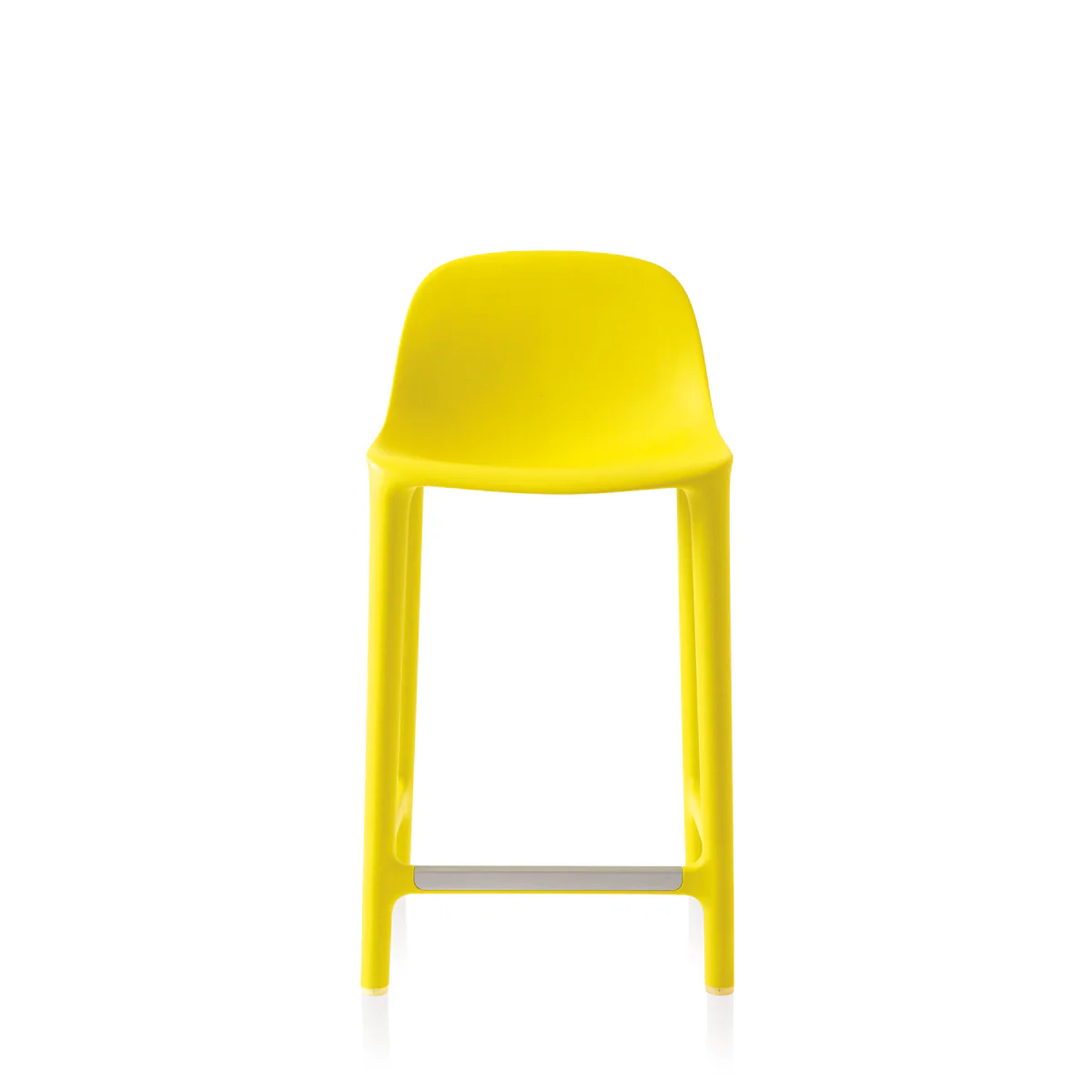 Broom Stool in yellow by Emeco, designed by Philippe Starck, features a minimalist design crafted from 75% waste polypropylene and 15% reclaimed wood, suitable for both indoor and outdoor use.
