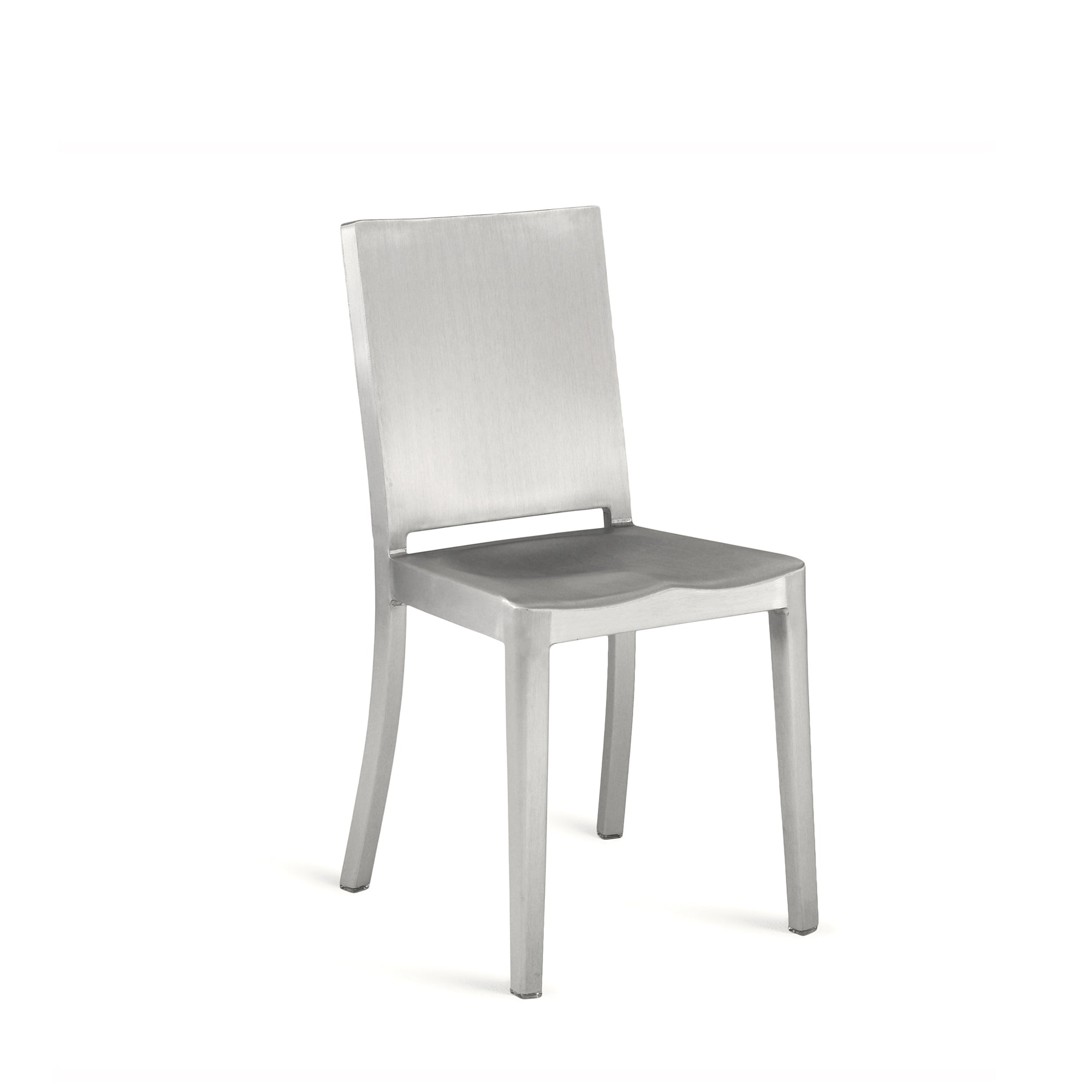 Philippe Starck's Hudson Chair by Emeco, a minimalist masterpiece featuring an industrial aluminum frame, designed for both style and durability.