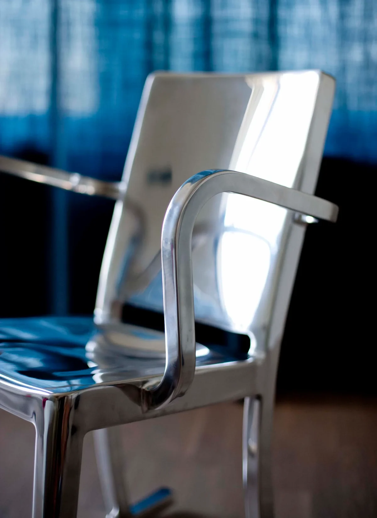 Emeco Hudson Rocking Chair with Arms, featuring a sleek design for stylish and comfortable seating.