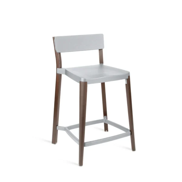 Lancaster stool by Emeco, designed by Michael Young, features a reclaimed solid ash wood frame and a recycled die-cast aluminum seat, combining natural materials with industrial design.