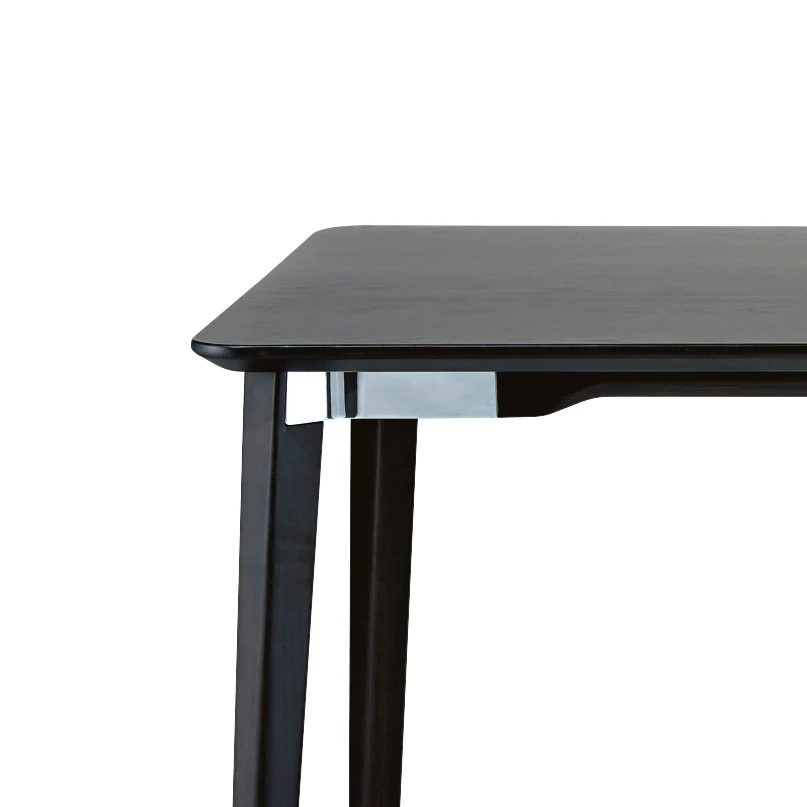 Lancaster dining table by Emeco, designed by Michael Young, features a solid ash wood top and base with die-cast aluminum connectors, combining natural materials with industrial design.