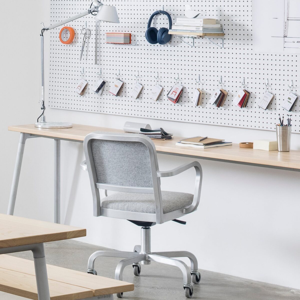 Elegant Navy Officer swivel chair by Jasper Morrison, combining navy fabric with polished aluminum for Emeco.