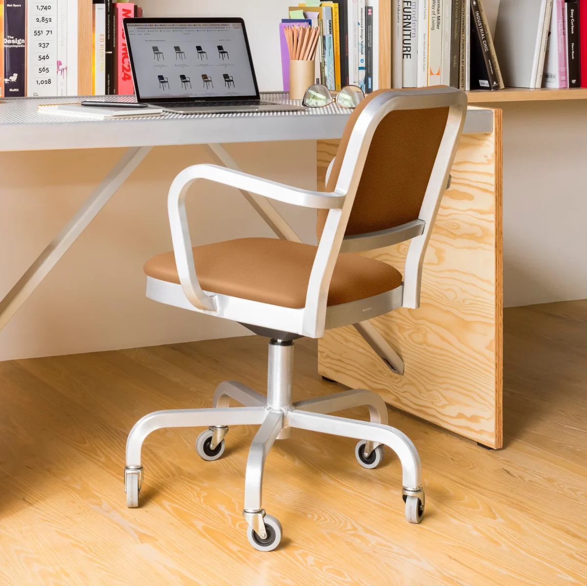 Navy Officer Swivel Armchair, designed by Jasper Morrison. Crafted from 80% recycled aluminum, this chair offers a sleek, modern aesthetic and ergonomic comfort.