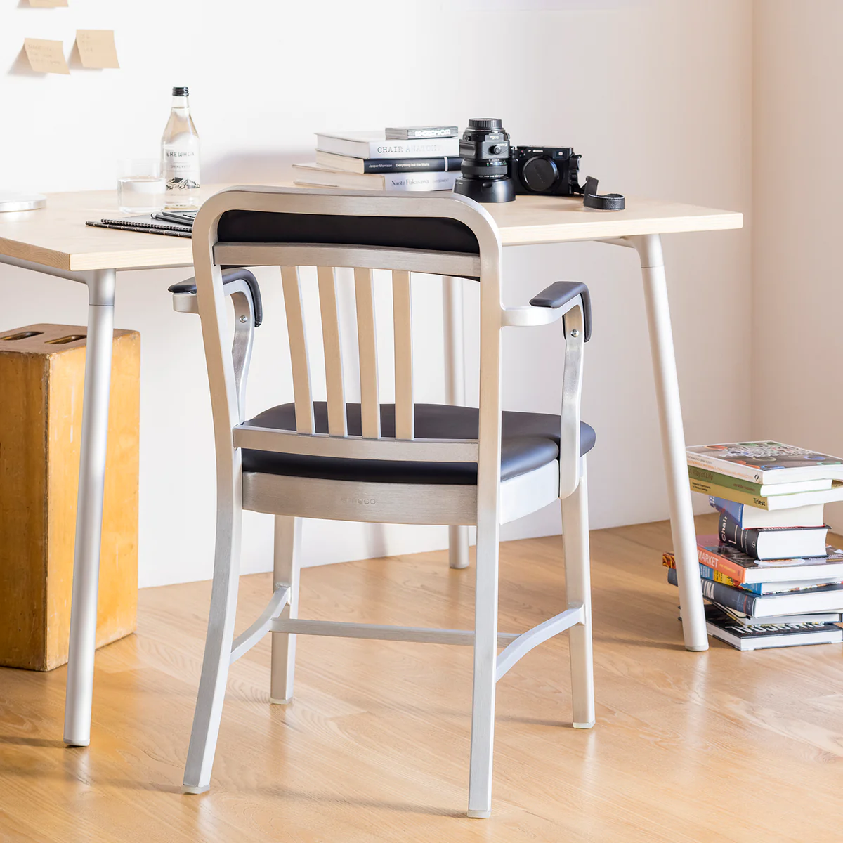 1011 Navy Classic Semi-upholstered Armchair by Emeco, a blend of durable design and comfort, featuring sleek lines and soft upholstery for modern, luxury interiors.