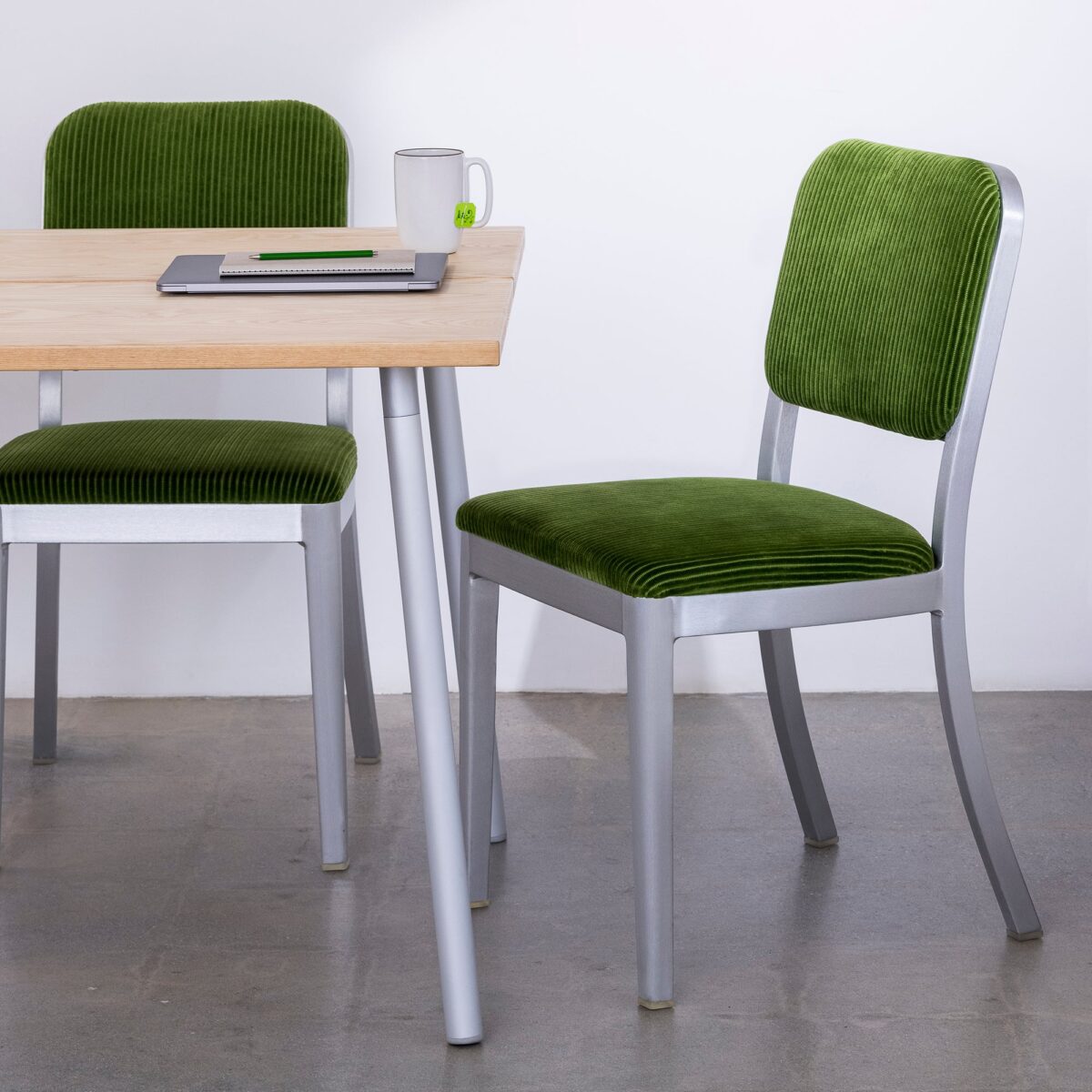 Sleek Navy Officer Side Chair with upholstered seat and recycled aluminum frame by Jasper Morrison.