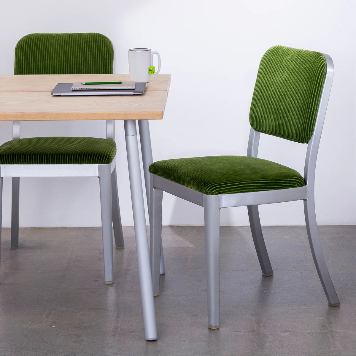 Navy Officer Side Chair by Emeco, a stylish and durable design with a sleek, modern frame, perfect for both residential and commercial spaces with a timeless appeal.