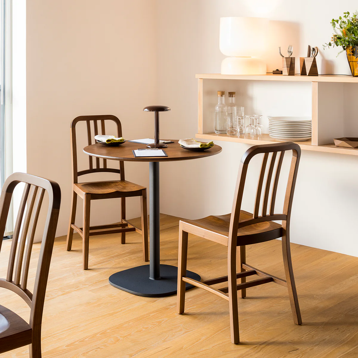 Navy® Wood Chair by Emeco, a refined blend of classic design and modern materials, featuring a sturdy wood seat with sleek lines for contemporary interiors.