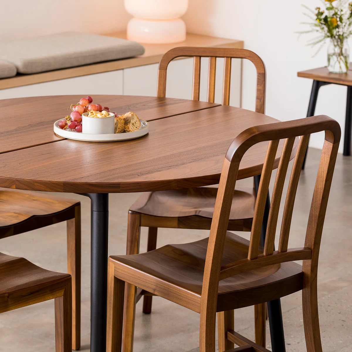 Navy® Wood Chair by Emeco, a refined blend of classic design and modern materials, featuring a sturdy wood seat with sleek lines for contemporary interiors.