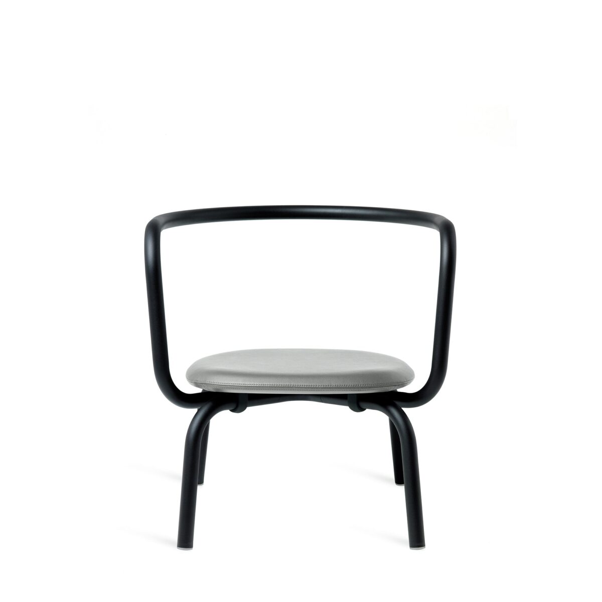 Modern Parrish Lounge Chair with a red powder-coated frame and black leather seating, designed by Konstantin Grcic.