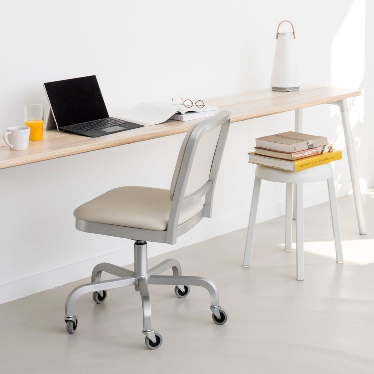 Stylish Navy Officer swivel chair by Jasper Morrison with a durable aluminum frame and soft navy upholstery.