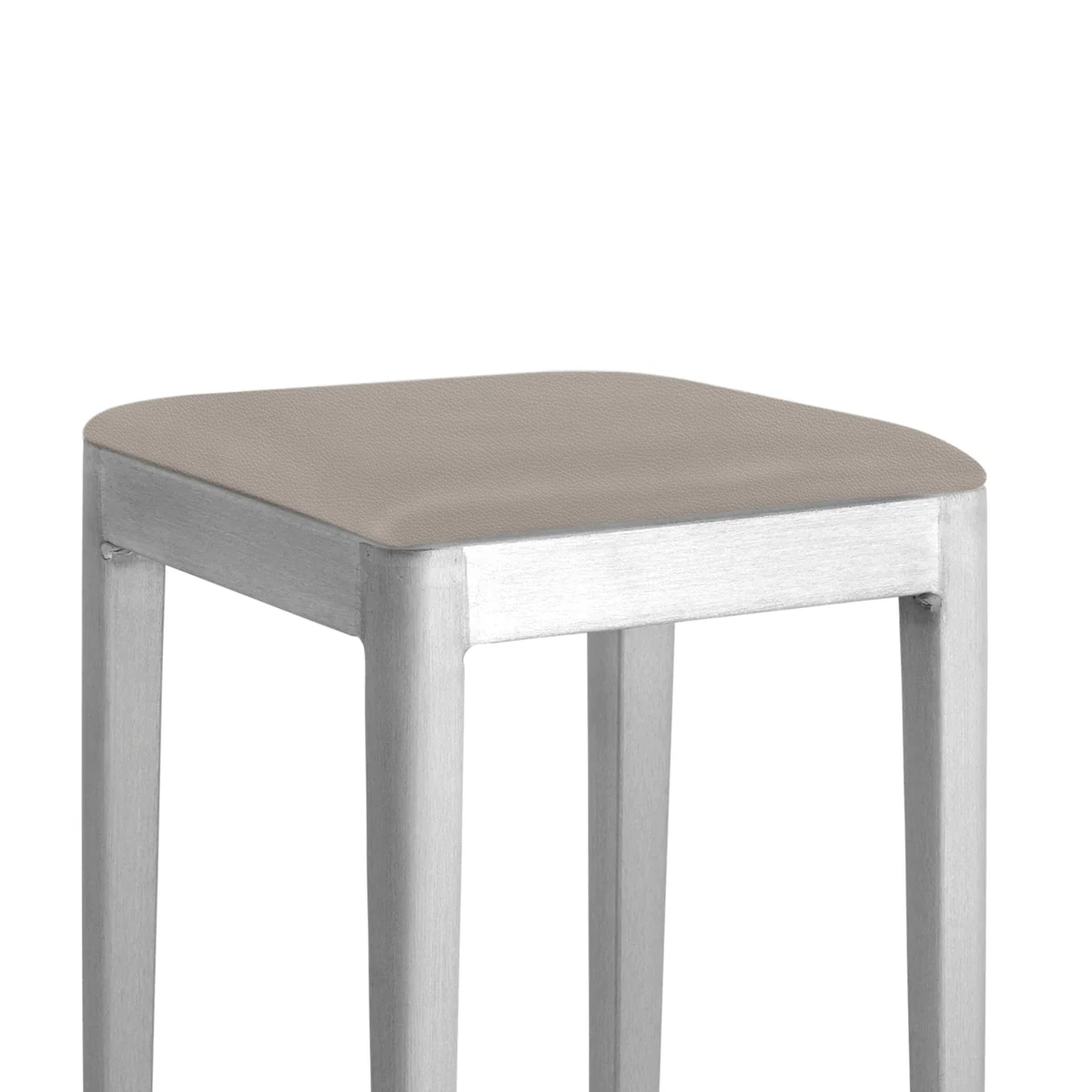Za Mini Stool in dark grey by Emeco, designed by Naoto Fukasawa, features a compact recycled aluminum frame with a powder-coated finish, suitable for both indoor and outdoor use.