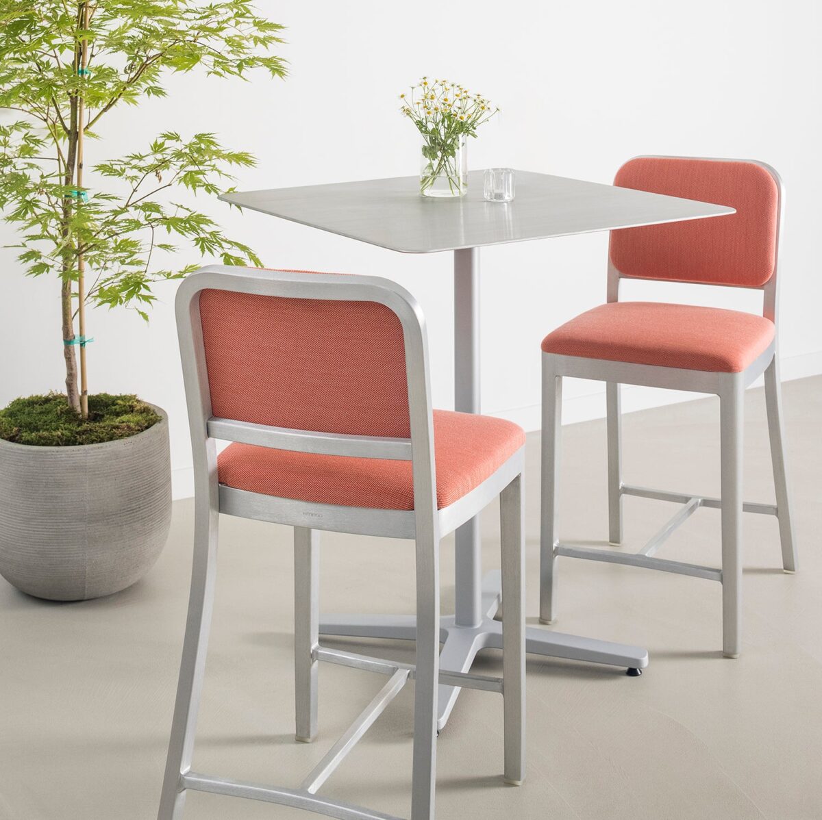 “Stylish Emeco Navy Officer Stool with classic Navy Chair details and elevated stool height.”
