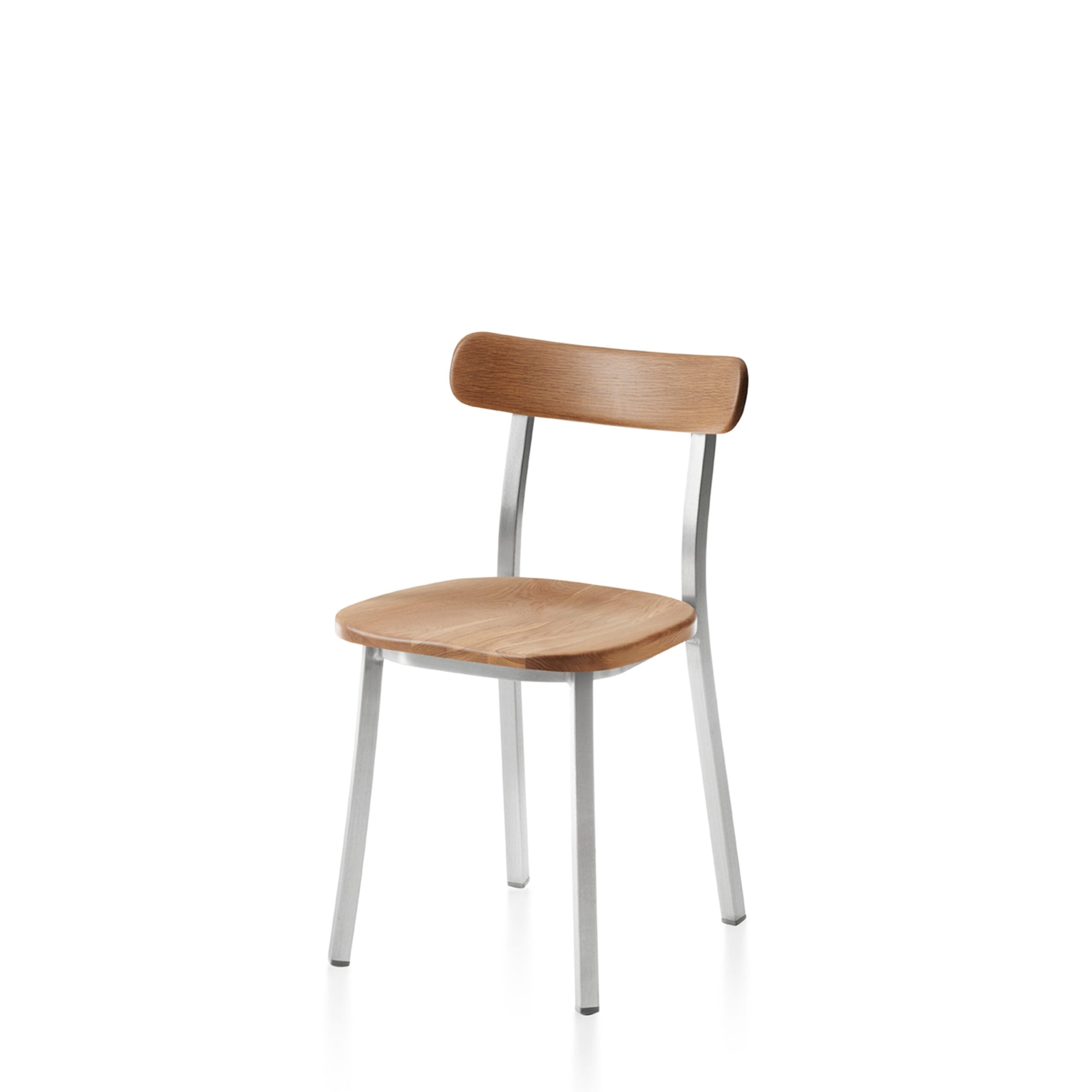 Minimalist utility side chair designed by Jasper Morrison with a sleek aluminum frame and wooden seat.